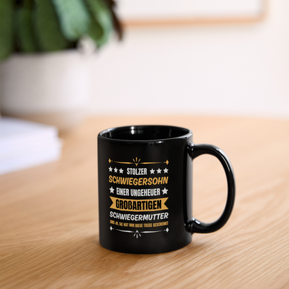 Tasse "Stolzer Schwiegersohn einer ungeheuer großartigen Schwiegermutter" - Schwarz
