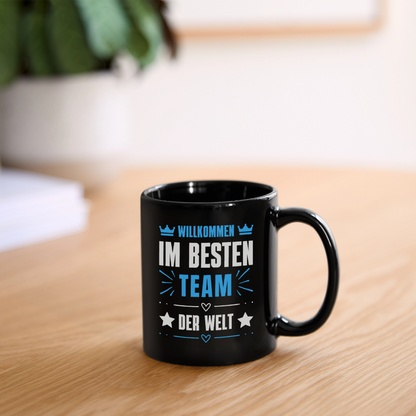 Schwarze Tasse "Willkommen im besten Team der Welt" - Schwarz