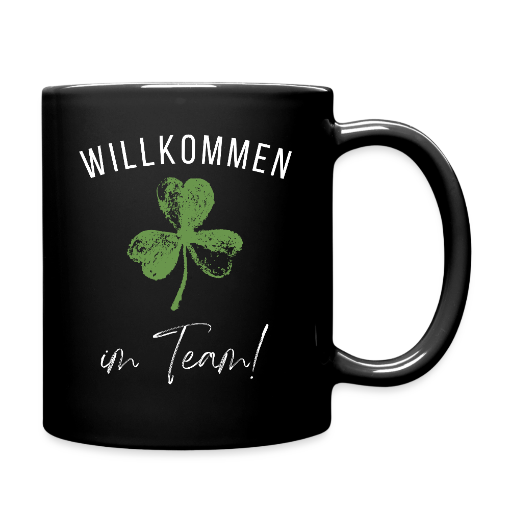 Schwarze Tasse "Willkommen im Team" (Kleeblatt) - Schwarz