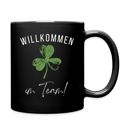 Schwarze Tasse "Willkommen im Team" (Kleeblatt) - Schwarz