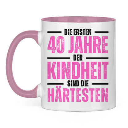 Tasse "Die ersten 40 Jahre der Kindheit sind die härtesten" (Pink) weiß/pink