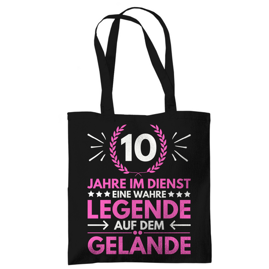 Tragetasche "10 Jahre im Dienst-Legende auf dem Gelände" (Pinkes Motiv) schwarz